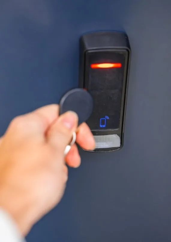 Close up view of a person using an electronic door lock