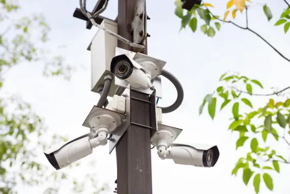 Pole-mounted HD CCTV cameras covering a site perimeter